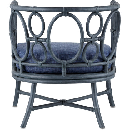 Tegal Chair by Currey and Company in vintage navy, indigo. Made from rattan, plywood, fabric, foam in a coastal style.