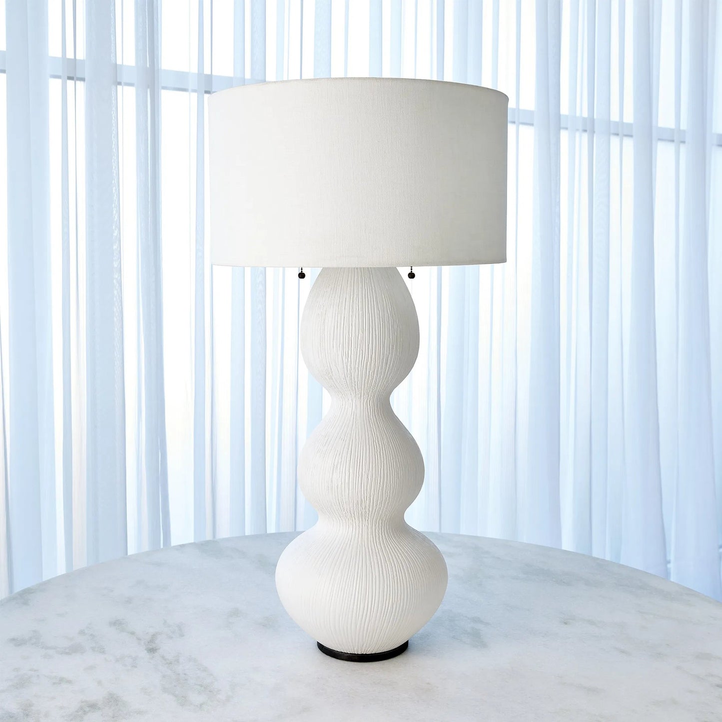 002 SI-2445653 | Lifestyle | Torch Table Lamp by Global Views in matte white. Made from ceramic, steel in a transitional style.