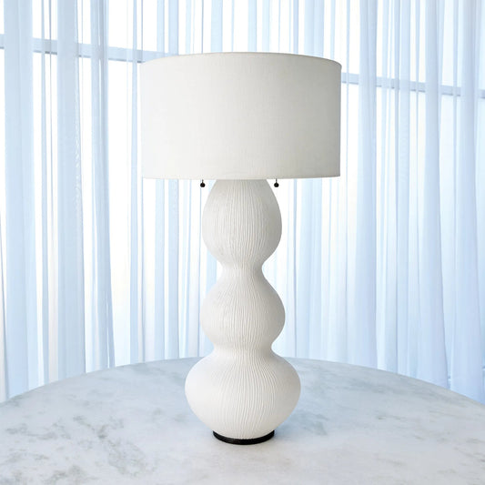 Torch Table Lamp by Global Views in matte white. Made from ceramic, steel in a transitional style.