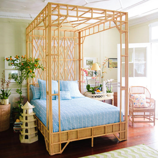 Paradise Canopy Bed by Chelsea House in tan. Made from rattan, wood in a rustic style.