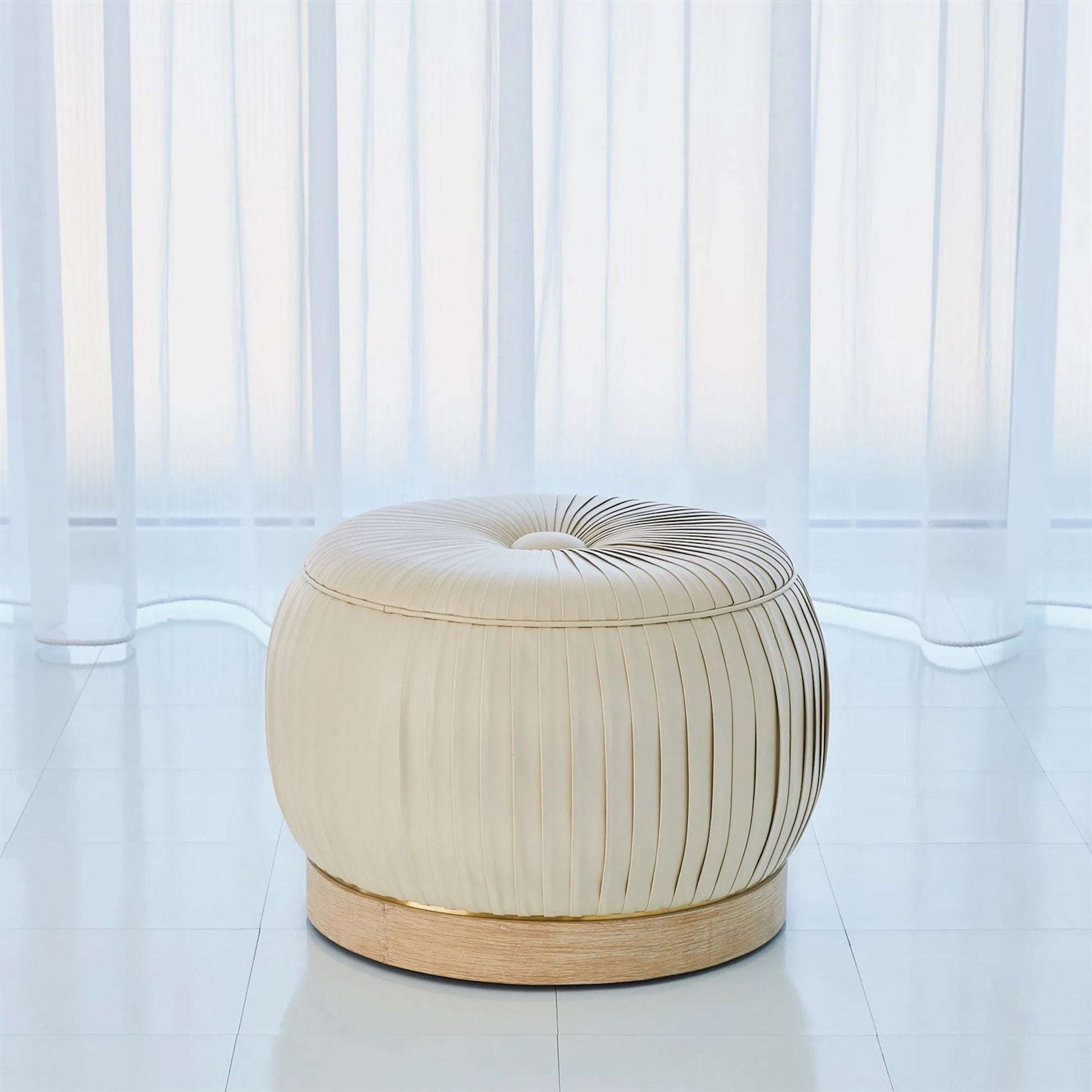 Colette Pouf by Global Views. Made from brass, leather in a modern style.