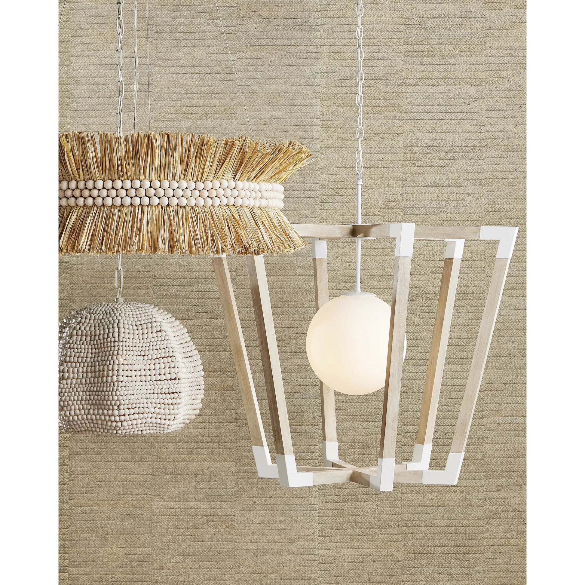 Seychelles Chandelier by Currey and Company in sugar white, natural raffia. Made from wrought iron, raffia, wood beads in a coastal style.