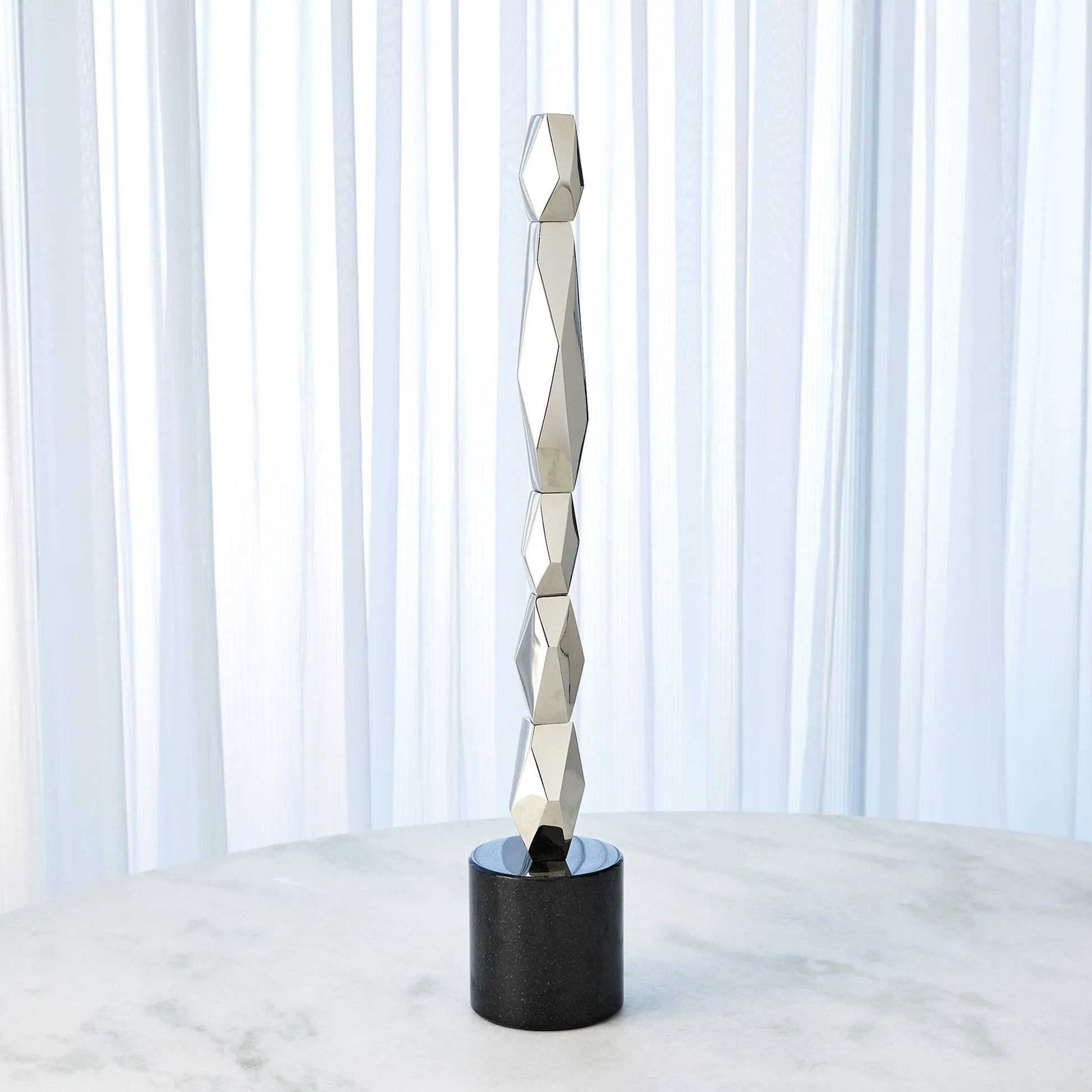 Facet Block Sculpture by Global Views. Made from unique in a unique style.