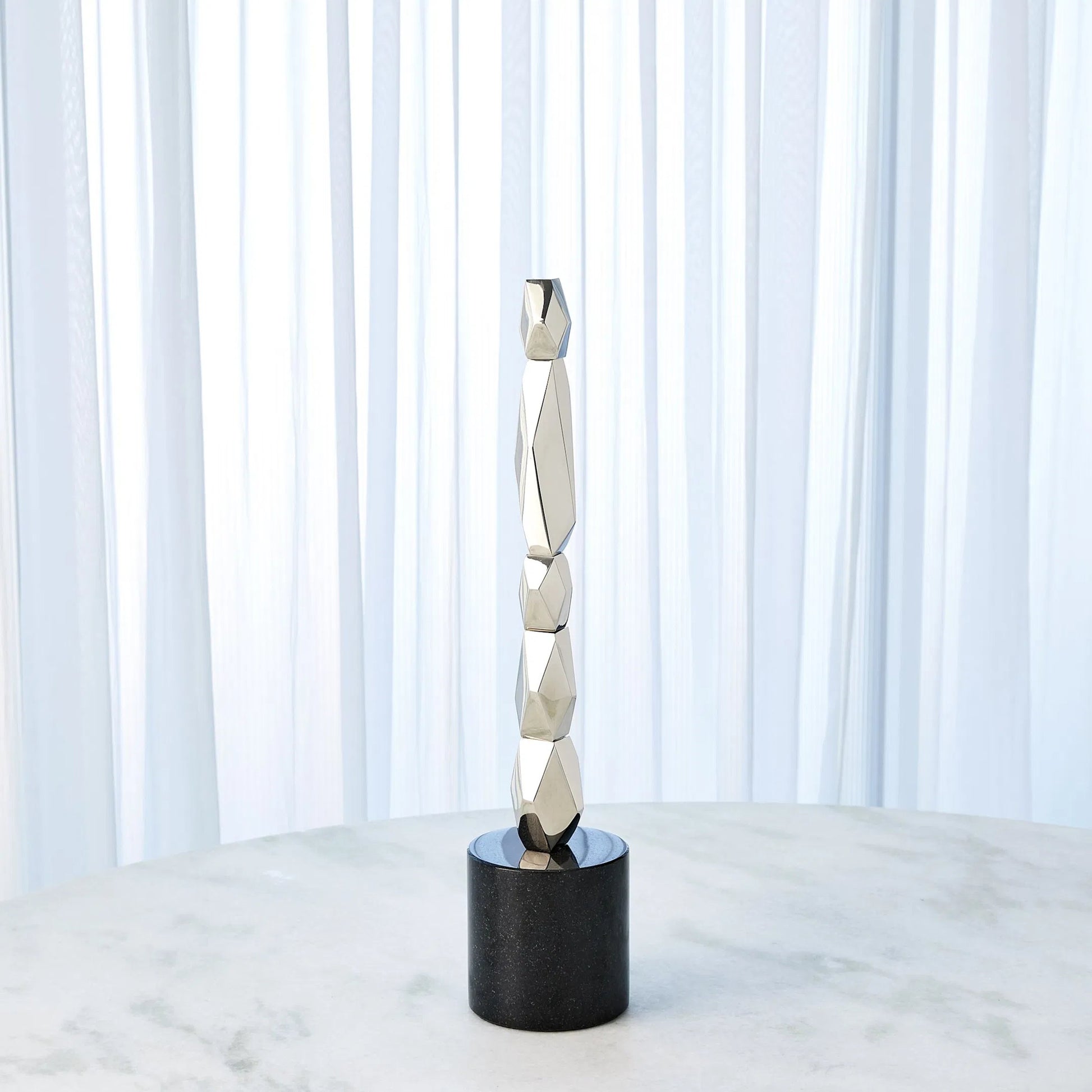 Facet Block Sculpture by Global Views. Made from unique in a unique style.