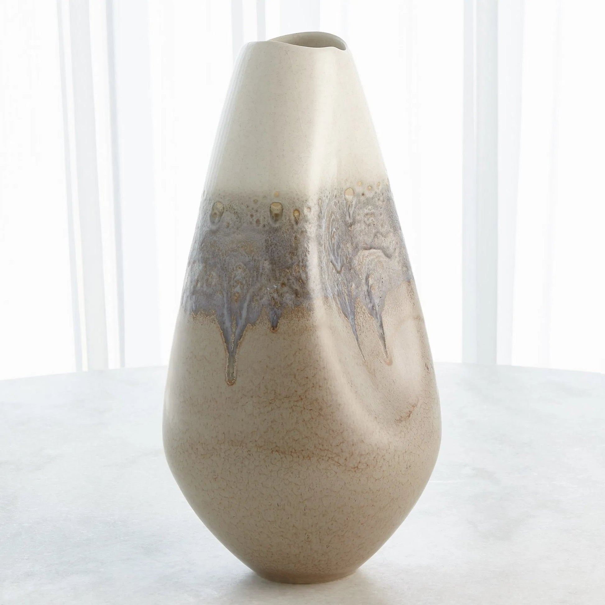Cream Rises Dented Vase by Global Views in cream and ivory. Made from unique in a modern style.