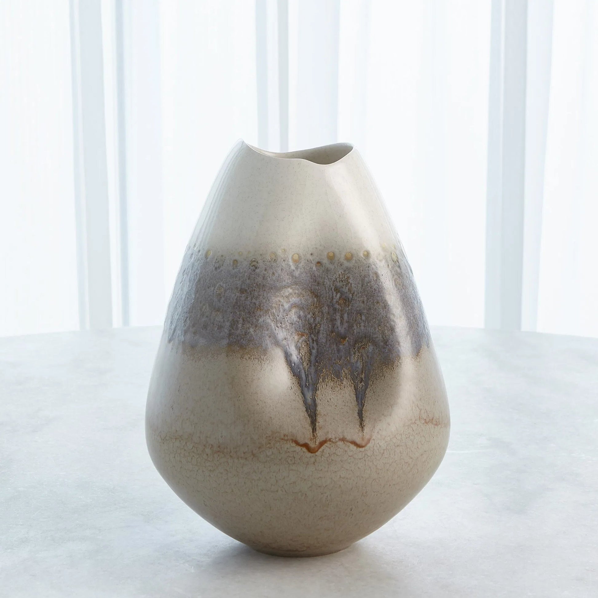 Cream Rises Dented Vase by Global Views in cream and ivory. Made from unique in a modern style.