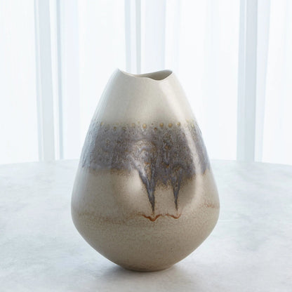 Cream Rises Dented Vase by Global Views in cream and ivory. Made from unique in a modern style.