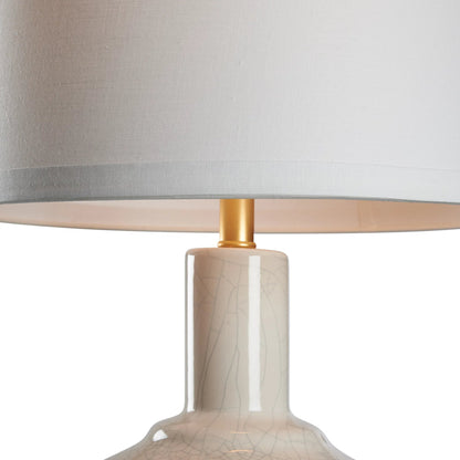 Emma Lamp by Wildwood in crackled snow glaze, antique gold leaf. Made from unique in a unique style.
