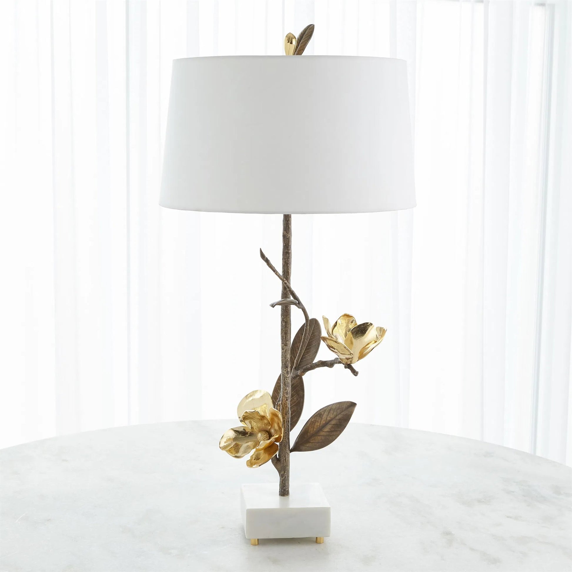 Magnolia Flower Table Lamp by Global Views in antique brass, gold. Made from brass, marble in a modern style.