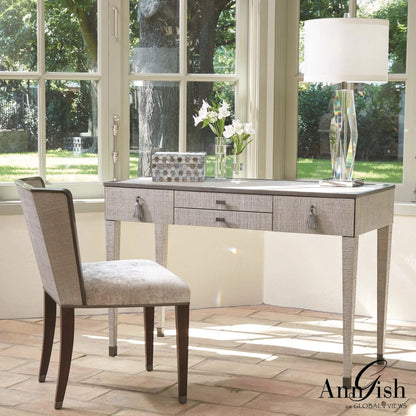 Argento Chair by Global Views in pewter. Made from acacia, beech, raffia, steel, velvet in a transitional style.