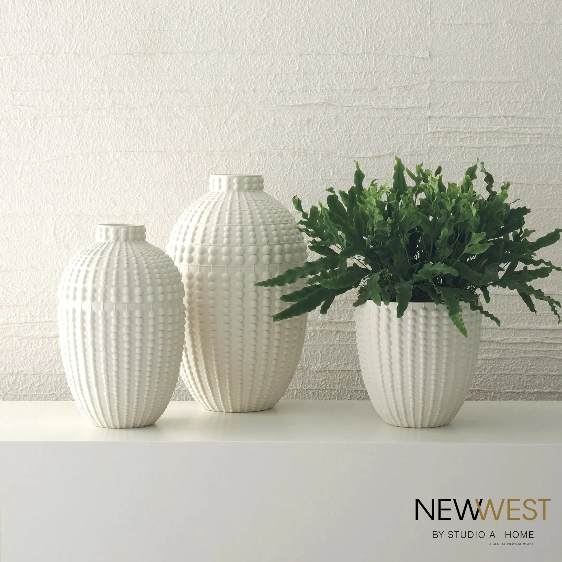 Nail Head Bowl by Global Views in rustic white. Made from ceramic in a coastal style.