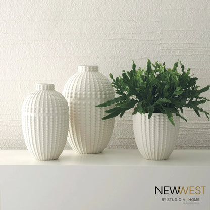Nail Head Bowl by Global Views in rustic white. Made from ceramic in a coastal style.