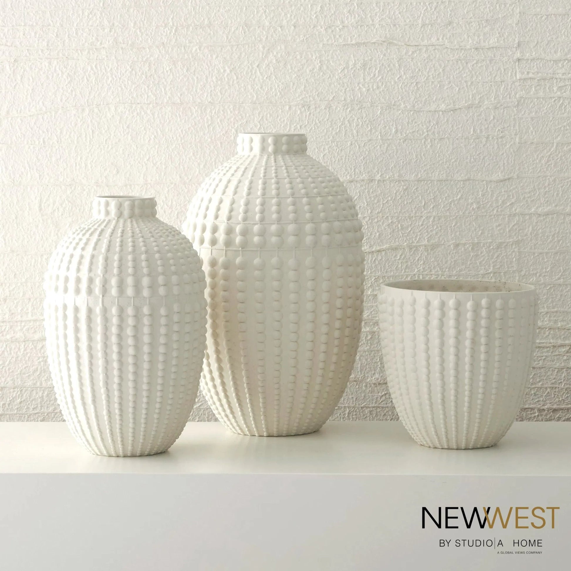 Nail Head Bowl by Global Views in rustic white. Made from ceramic in a coastal style.