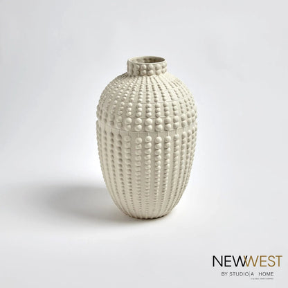 Nail Head Vase by Global Views in rustic white. Made from ceramic in a coastal style.