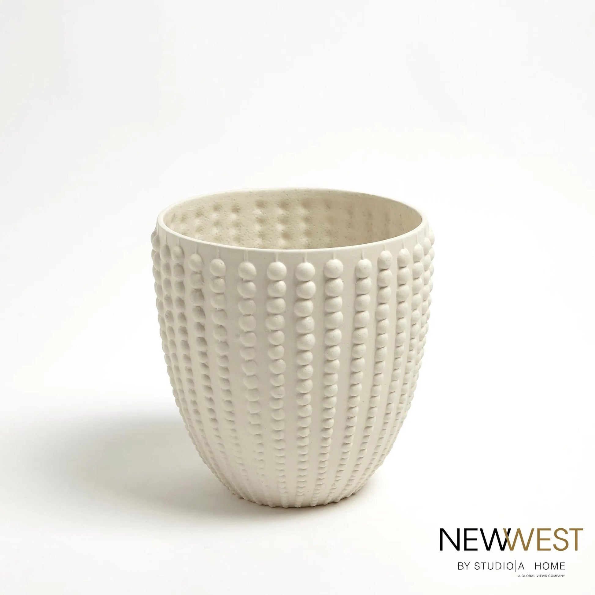 Nail Head Bowl by Global Views in rustic white. Made from ceramic in a coastal style.
