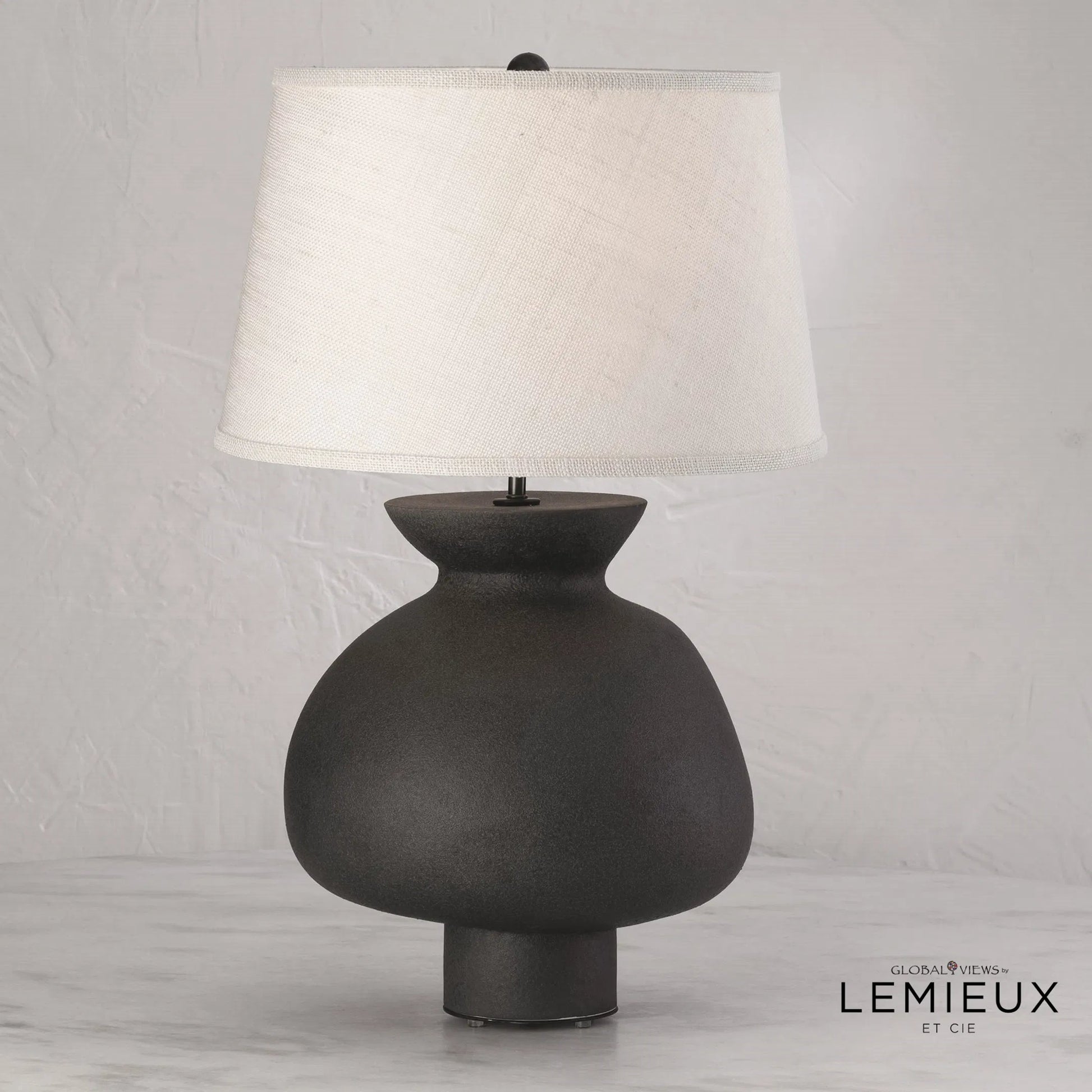 Casis Lamp by Global Views in matte black. Made from earthenware in a eclectic & global style.