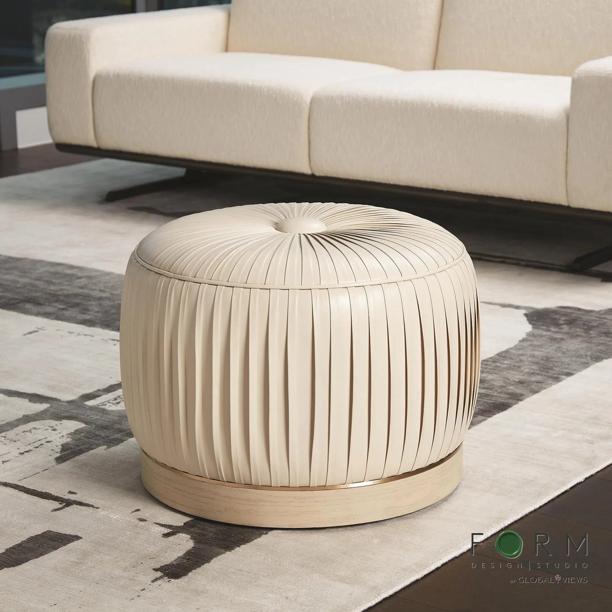 Colette Pouf by Global Views. Made from brass, leather in a modern style.