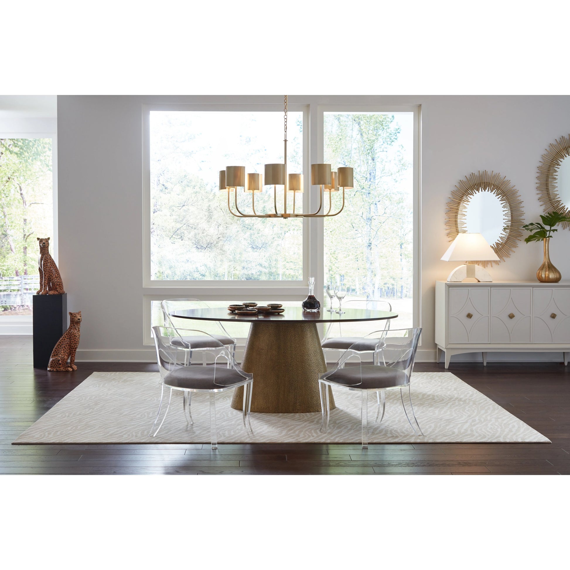 Castle Yard Chandelier by Wildwood in antique brass. Made from steel in a modern style.