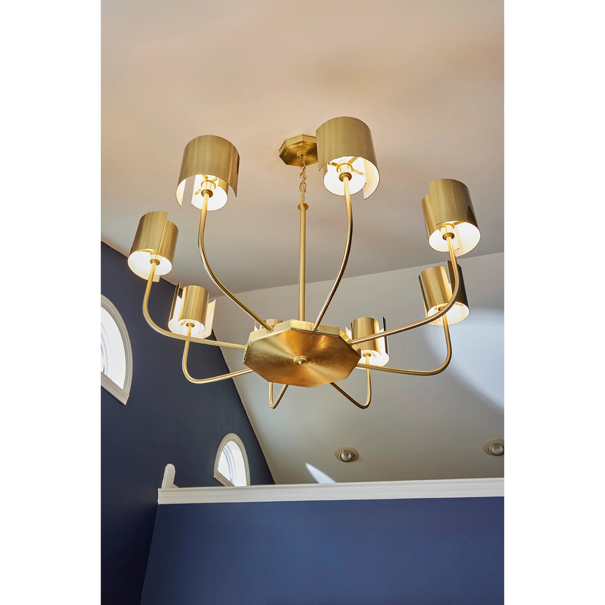 Castle Yard Chandelier by Wildwood in antique brass. Made from steel in a modern style.