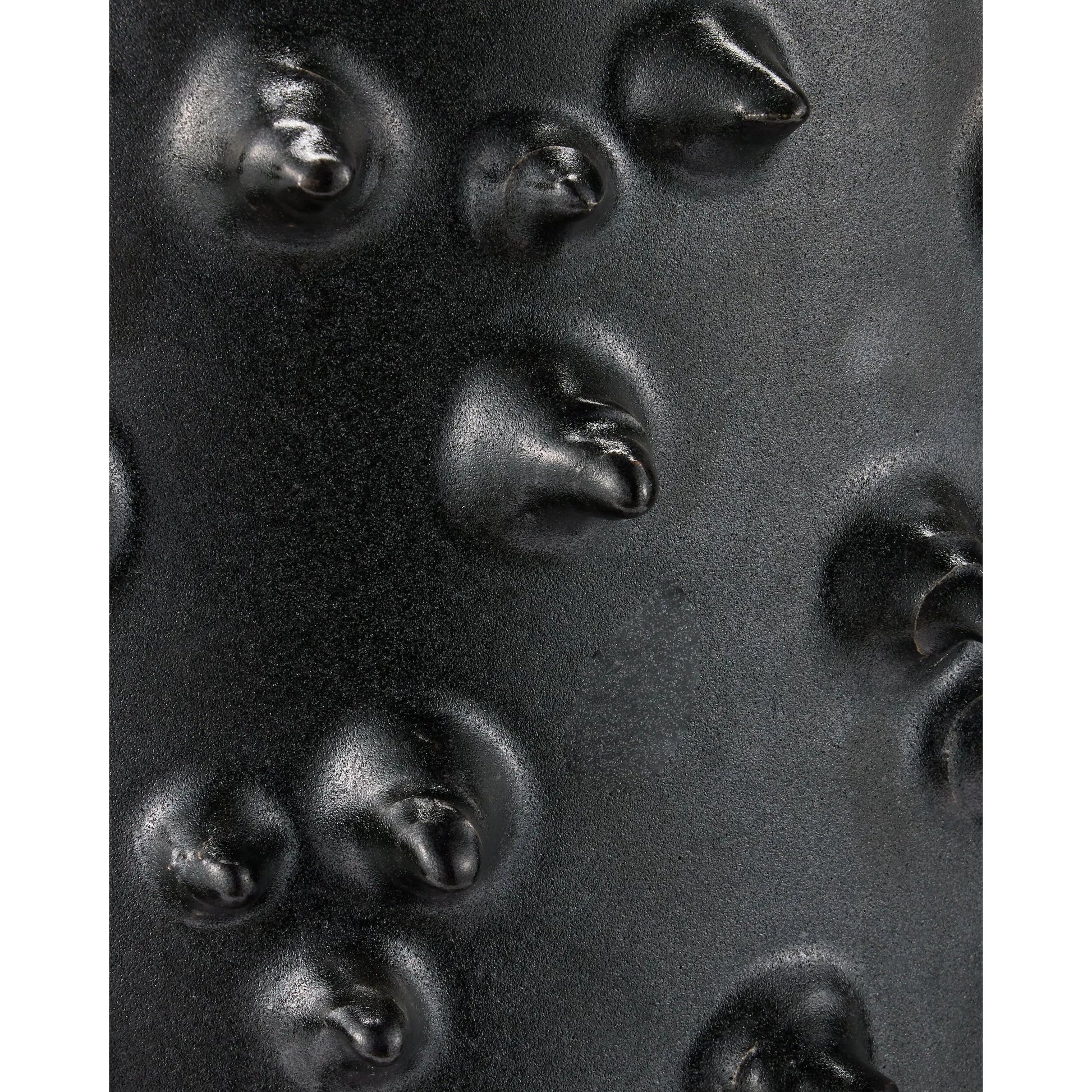 Baltz Accent Table by Currey and Company in black. Made from ceramic in a unique style.