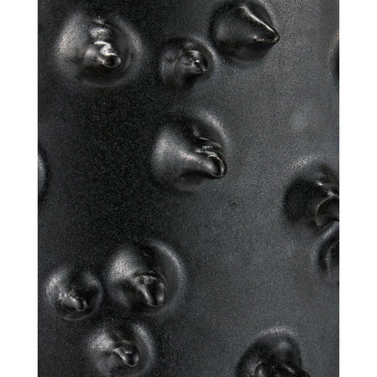 Baltz Accent Table by Currey and Company in black. Made from ceramic in a unique style.