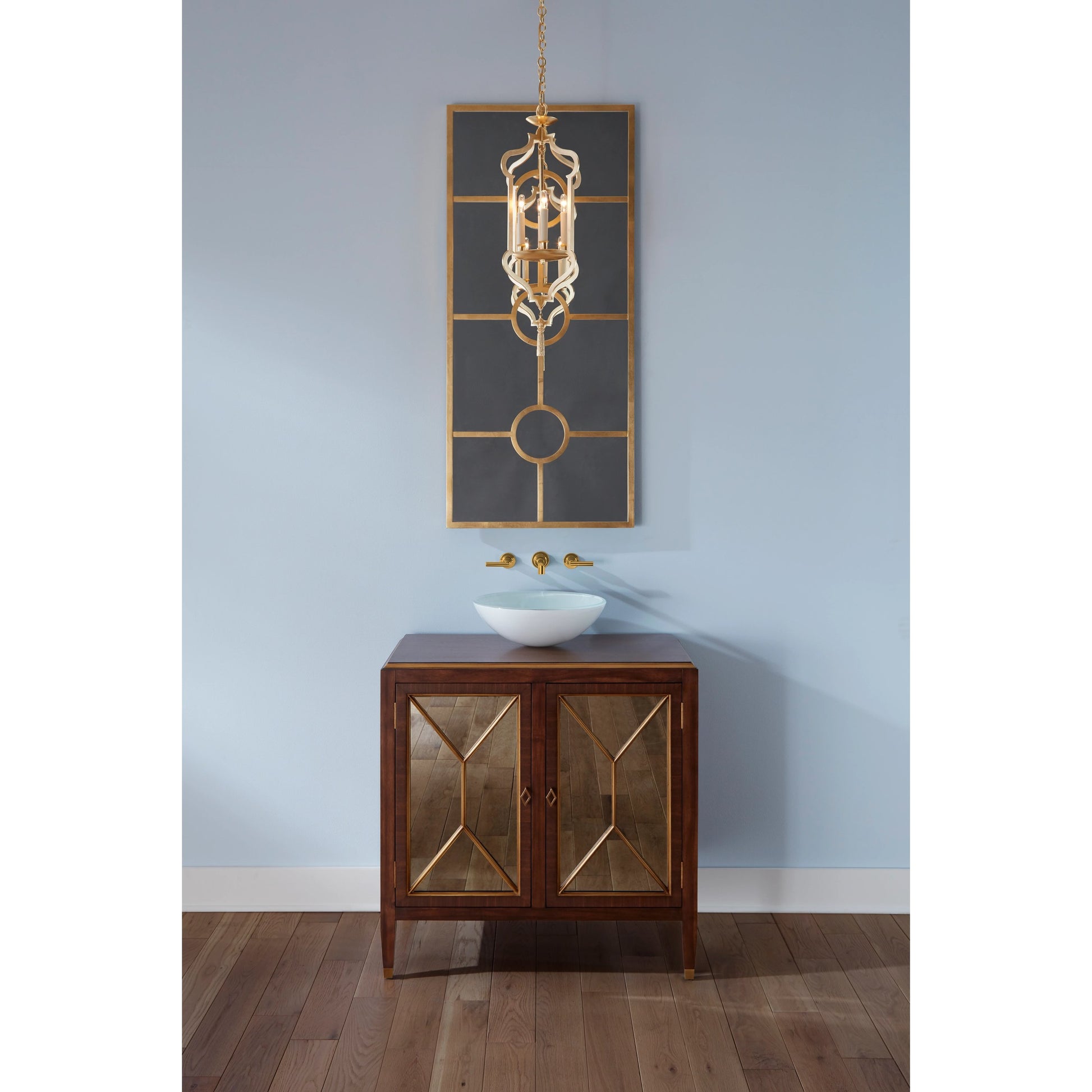 Odaslisque Lantern by Wildwood in gold leaf. Made from iron in a transitional style.