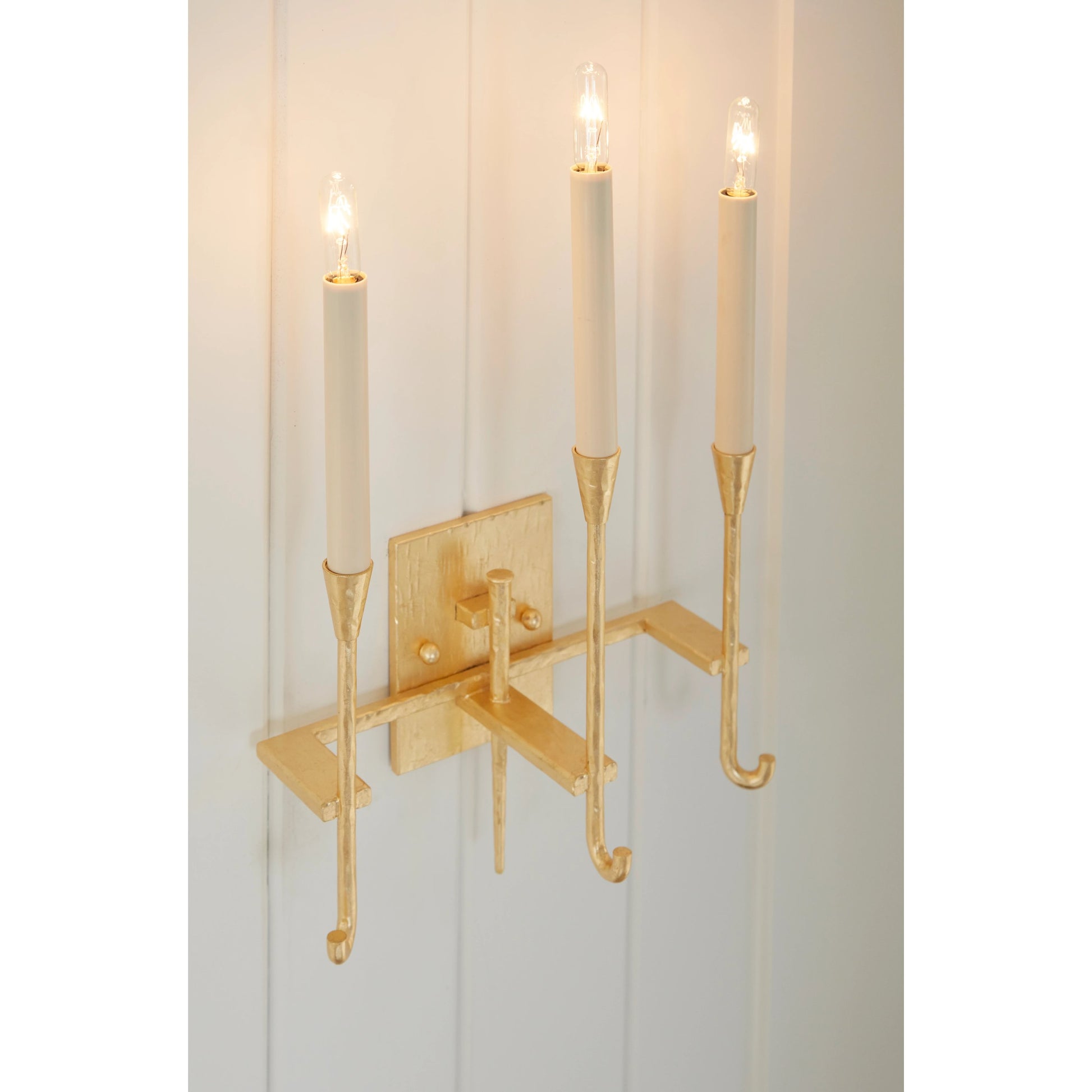 Diego Sconce by Wildwood in hammered, gold leaf. Made from steel in a modern style.
