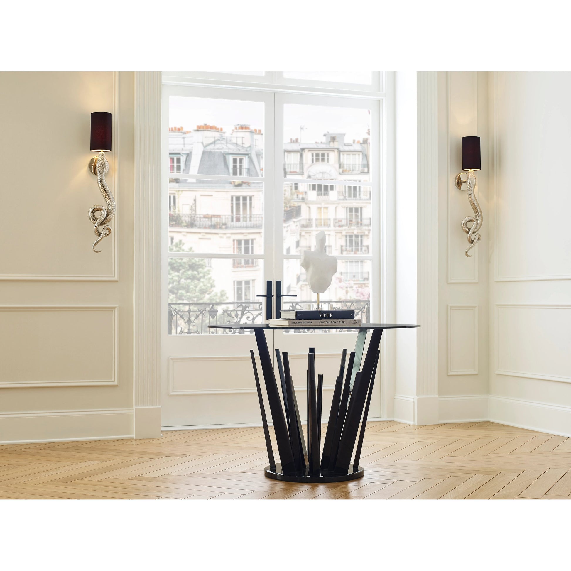 Sapera Sconce by Wildwood in brass. Made from iron in a modern style.