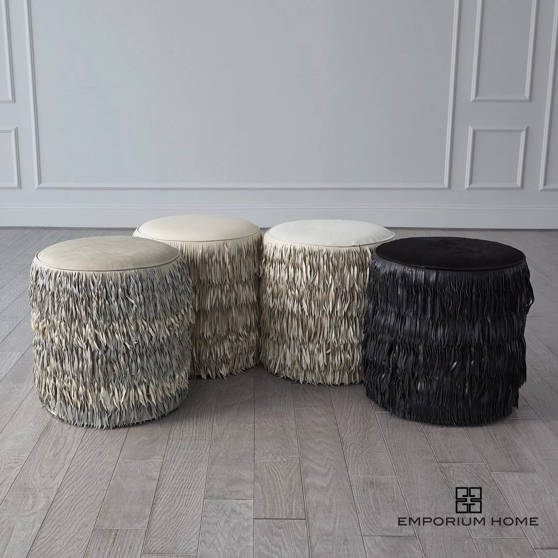 Fringe Ottoman by Global Views. Made from mdf, leather, pvc in a unique style.