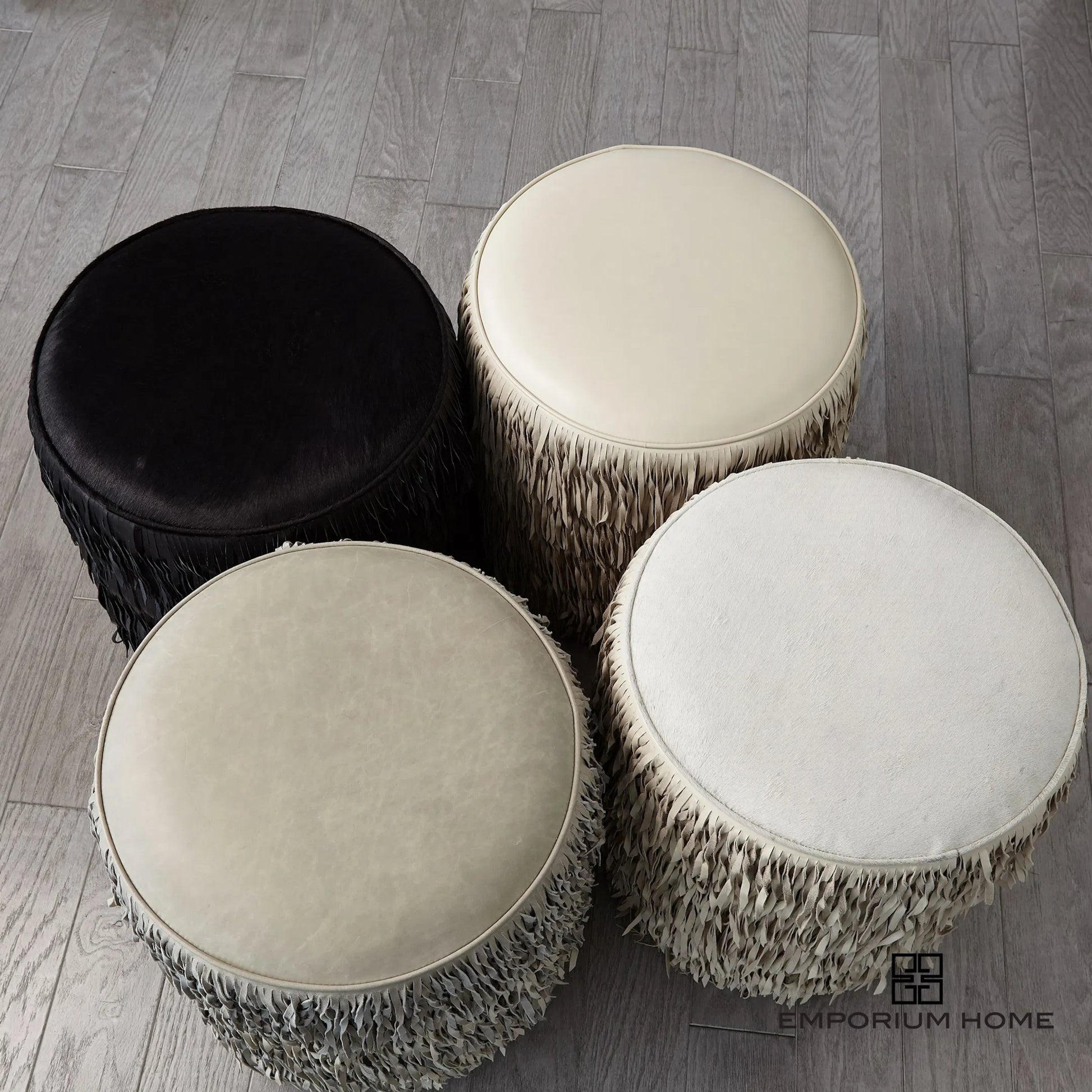 Fringe Ottoman by Global Views. Made from mdf, leather, pvc in a unique style.