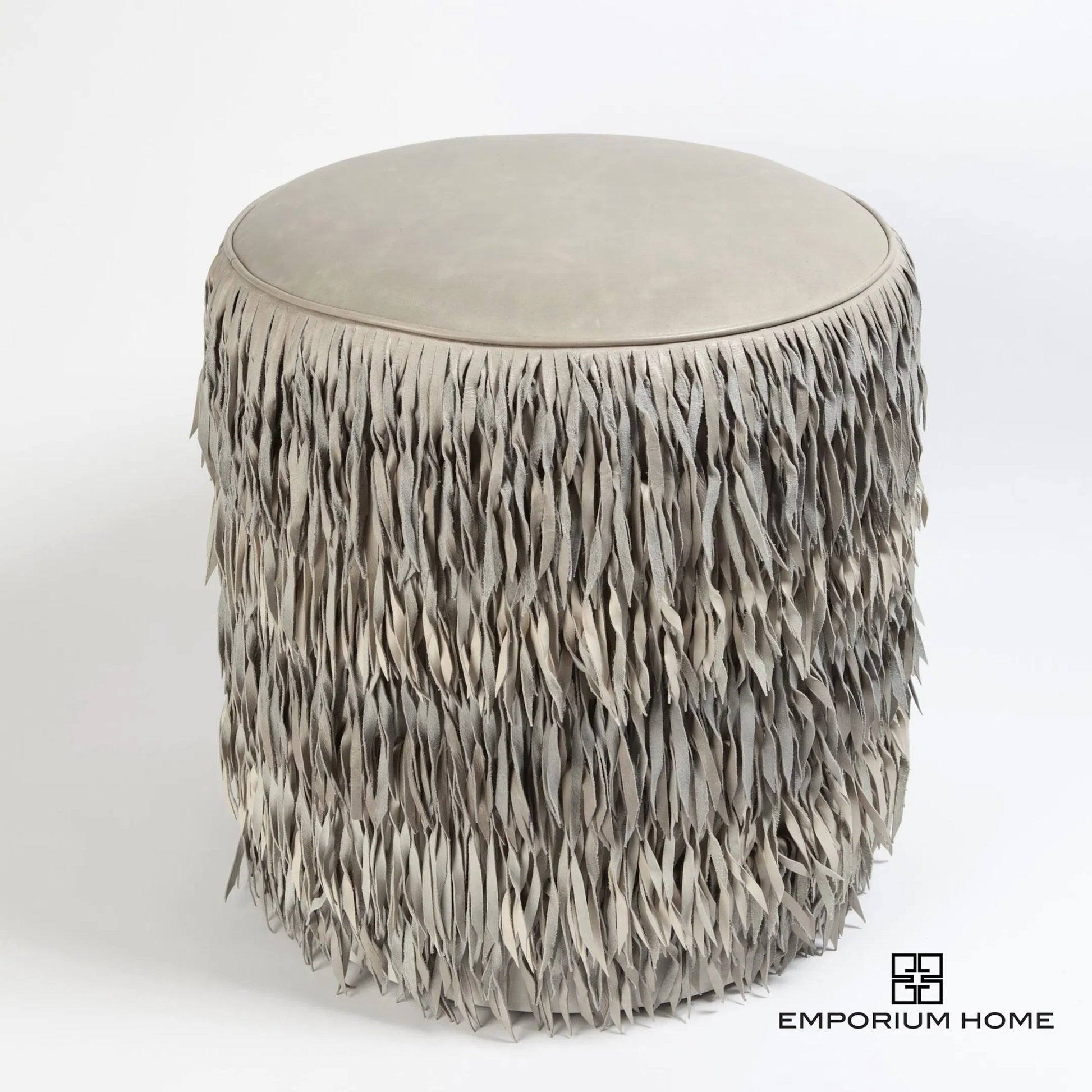 Fringe Ottoman by Global Views. Made from mdf, leather, pvc in a unique style.