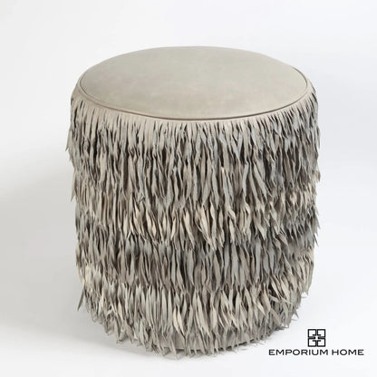 Fringe Ottoman by Global Views. Made from mdf, leather, pvc in a unique style.