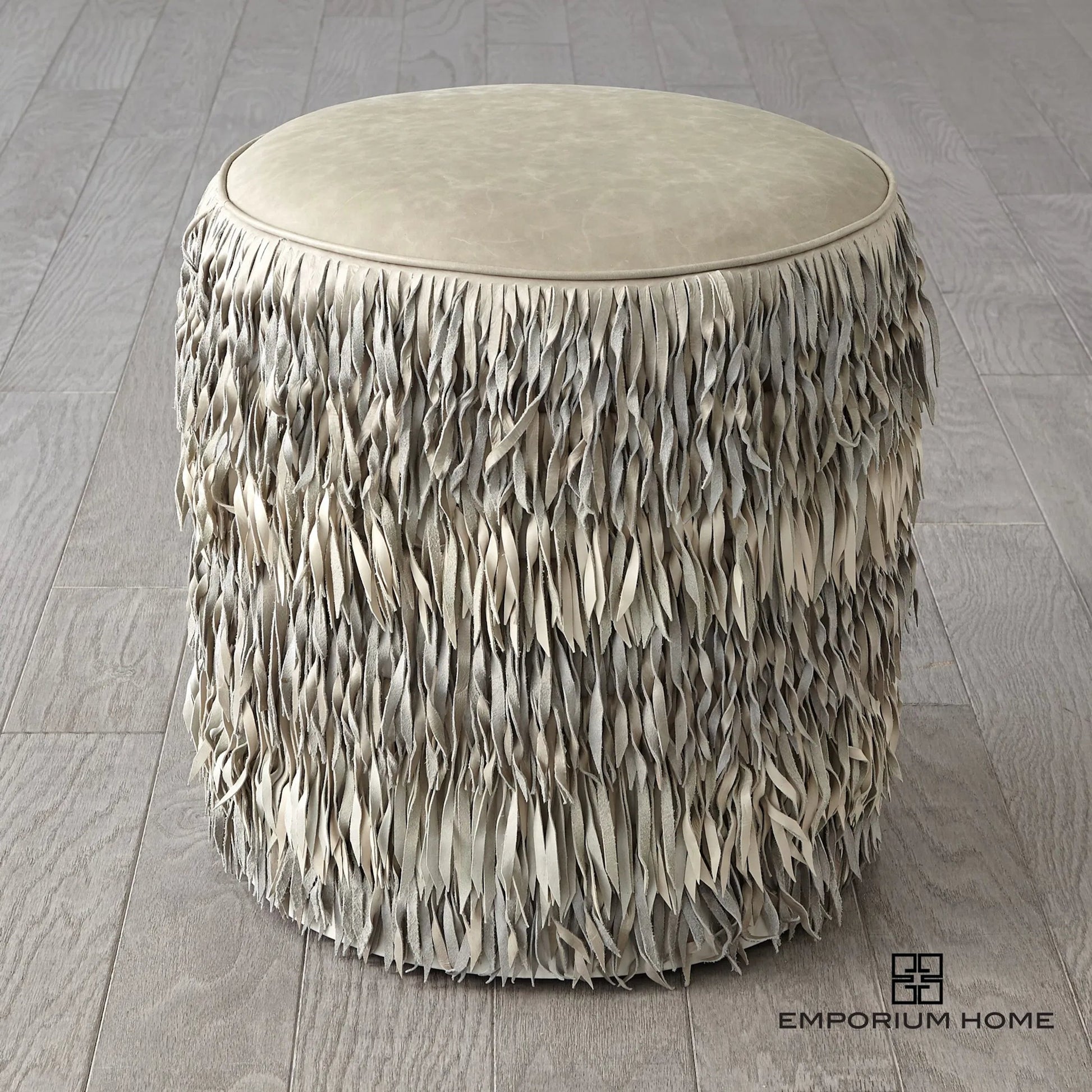 Fringe Ottoman by Global Views. Made from mdf, leather, pvc in a unique style.