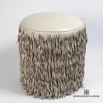Fringe Ottoman by Global Views. Made from mdf, leather, pvc in a unique style.