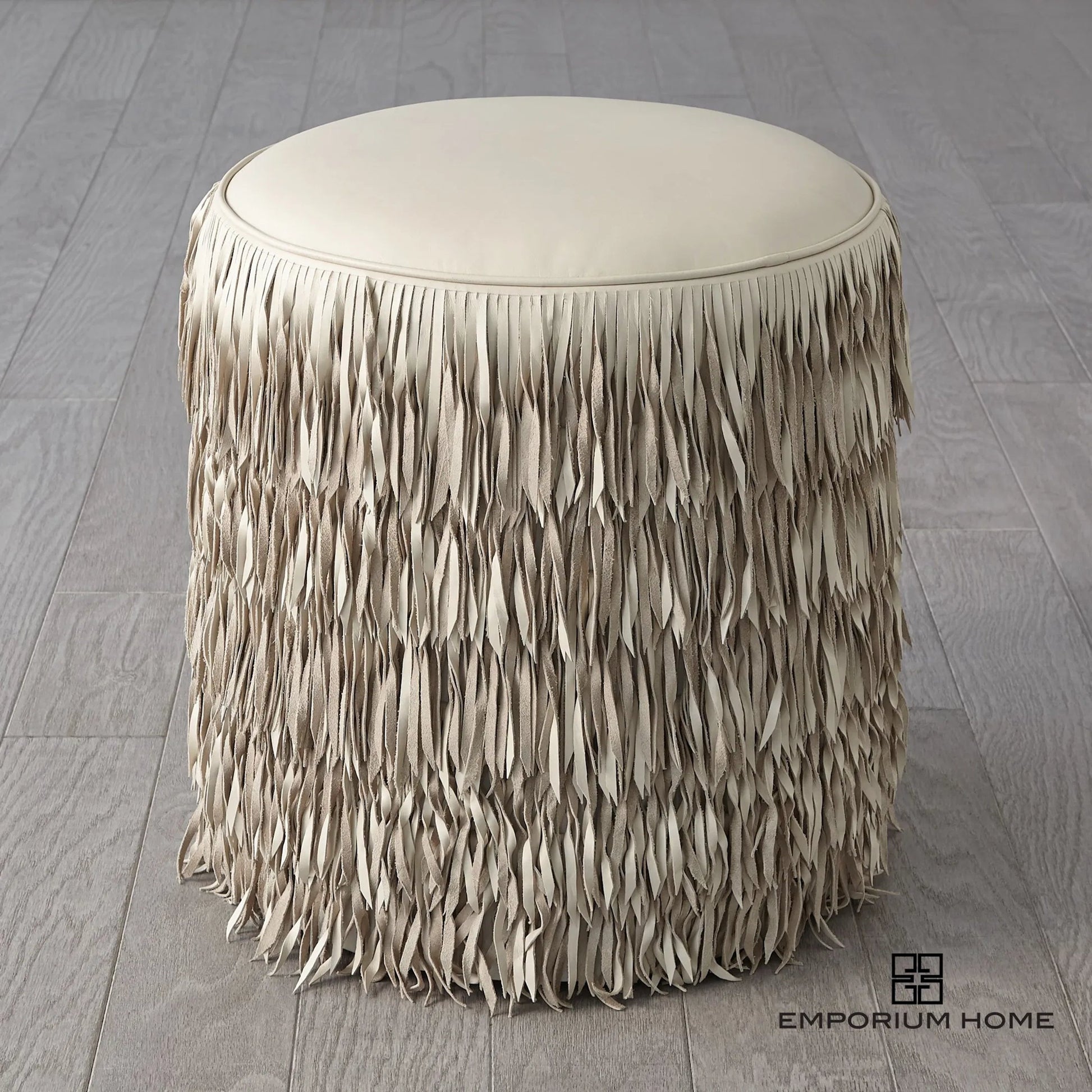 Fringe Ottoman by Global Views. Made from mdf, leather, pvc in a unique style.