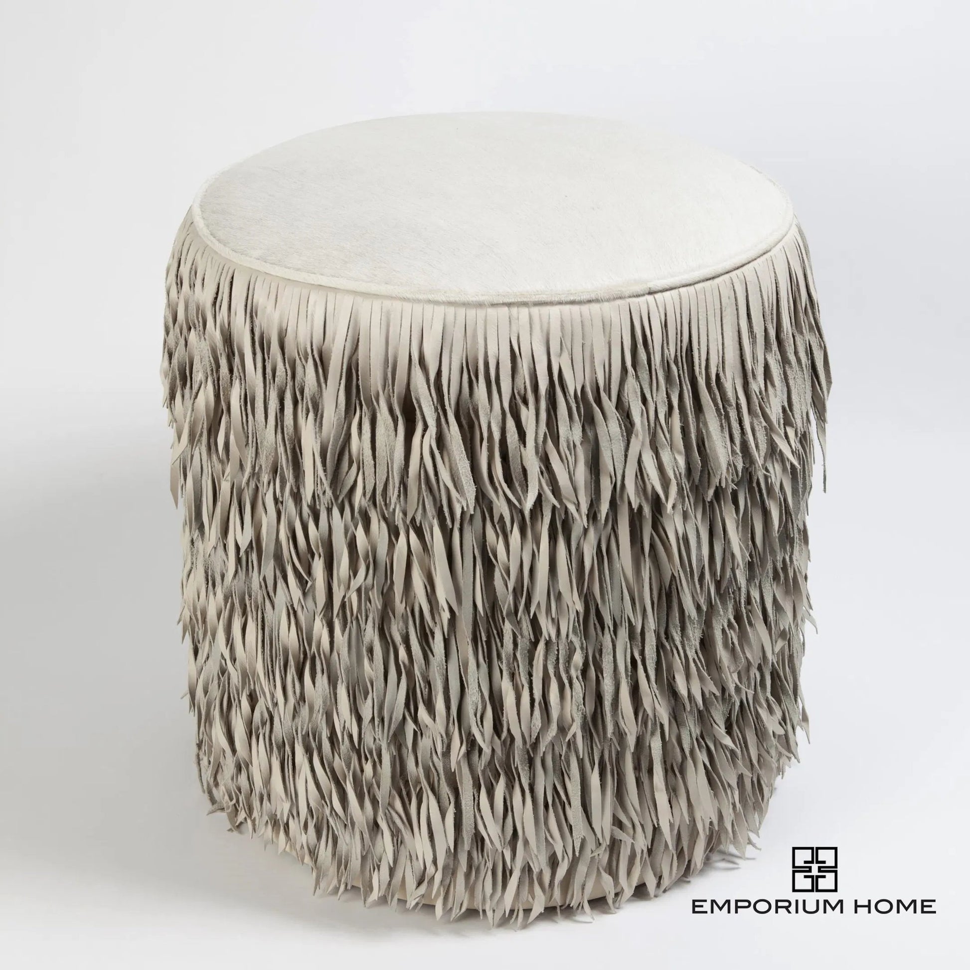 Fringe Ottoman by Global Views. Made from mdf, leather, pvc in a unique style.
