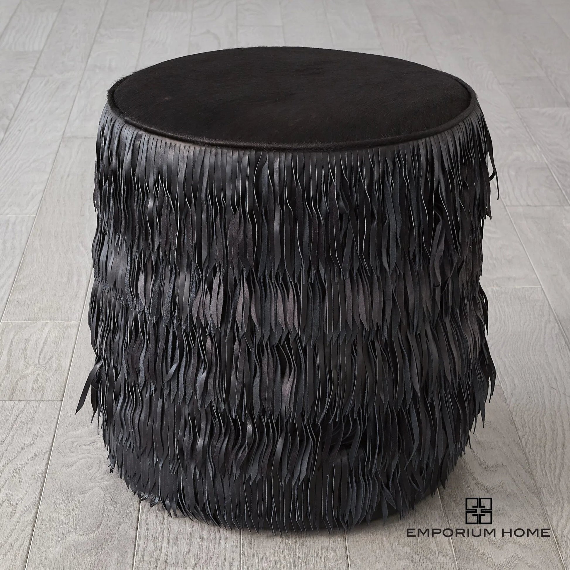 Fringe Ottoman by Global Views. Made from mdf, leather, pvc in a unique style.