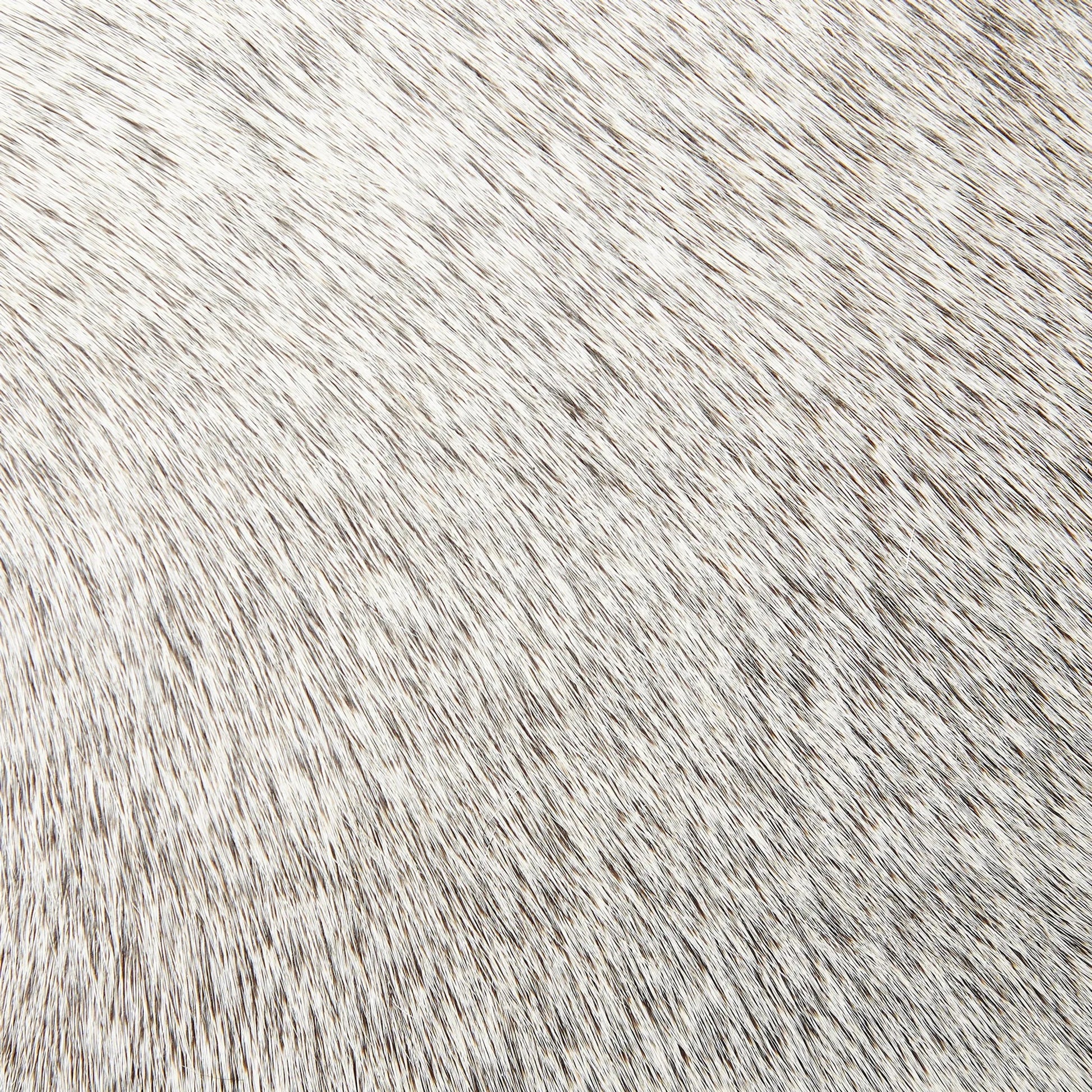 Urban Ottoman with Hair-On-Hide by Global Views. Made from mango, plyboard, iron in a transitional style.