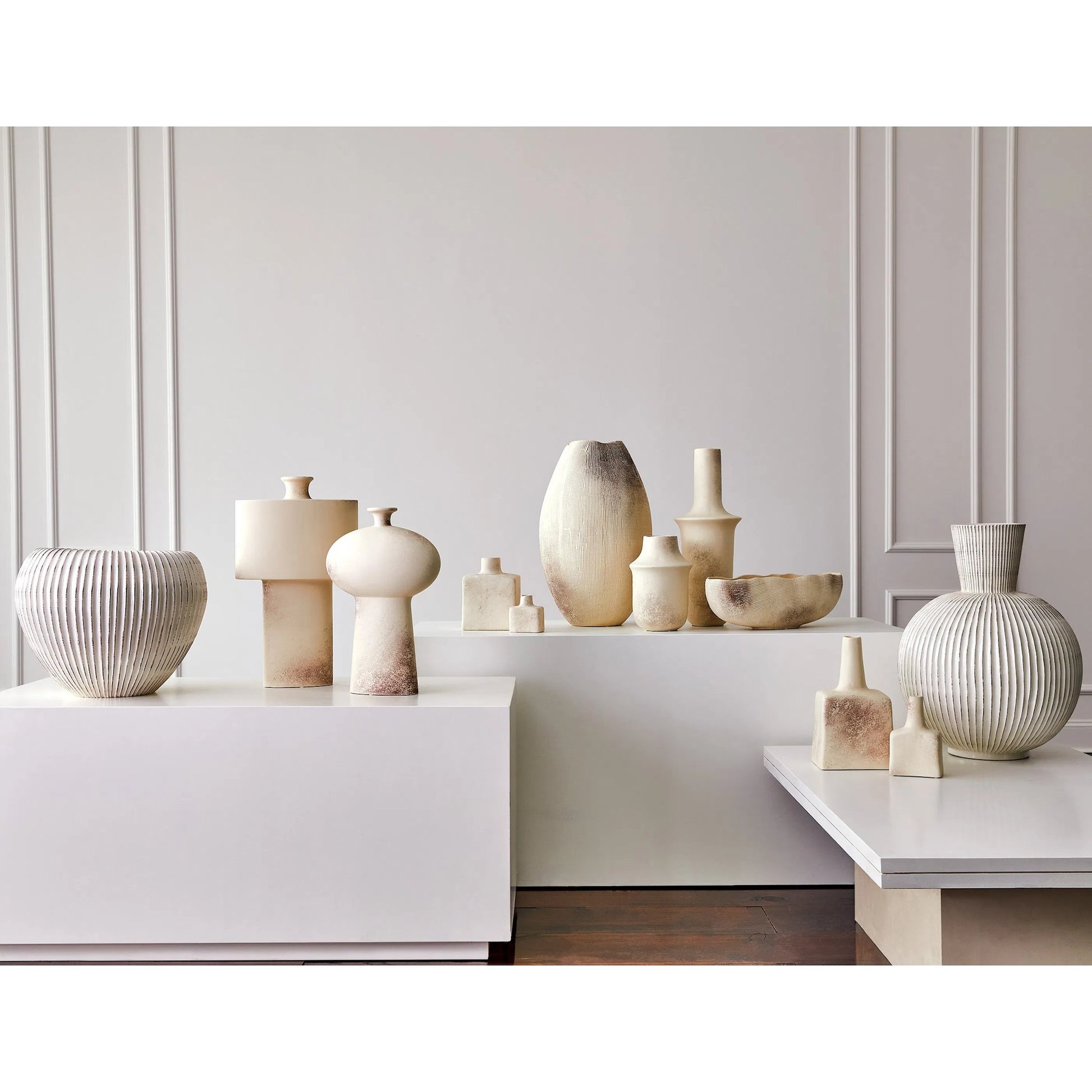 Tall Stack Bottle by Global Views in reactive ivory. Made from earthenware in a eclectic & global style.