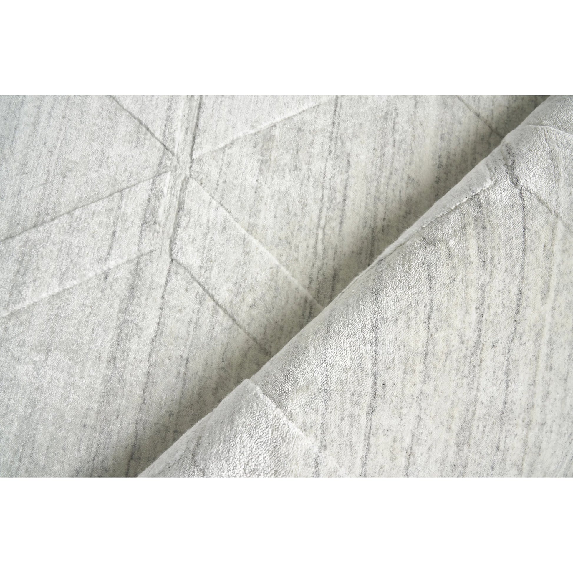 Lotus Pattern Rug by Exquisite Rugs in ivory. Made from wool, bamboo silk in a unique style.
