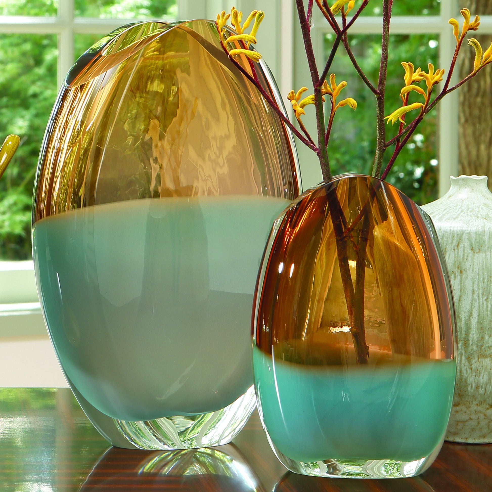 Pistachio Bubble Amber Oval Vase by Global Views. Made from art glass in a coastal style.