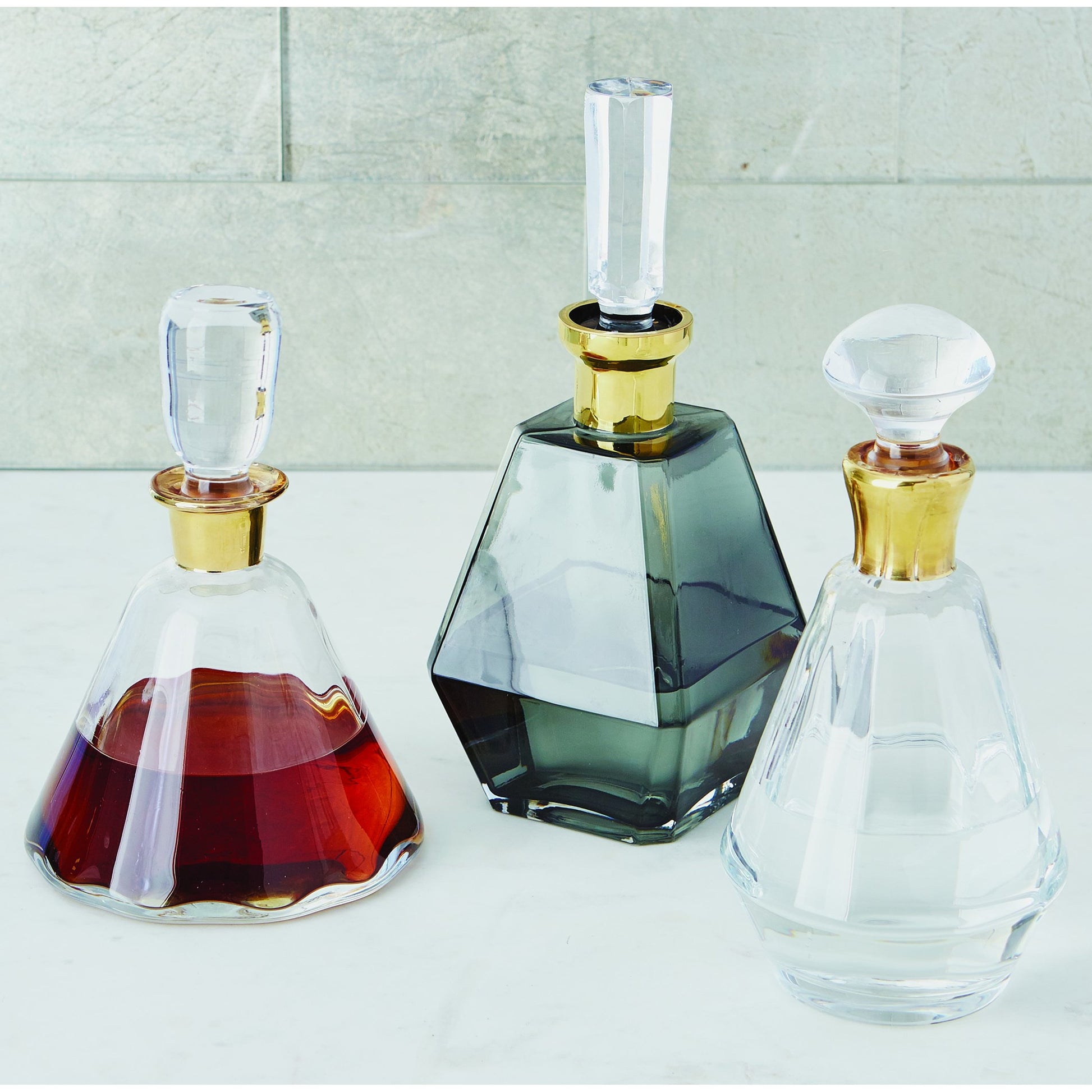 Cone Decanter by Global Views. Made from glass in a transitional style.