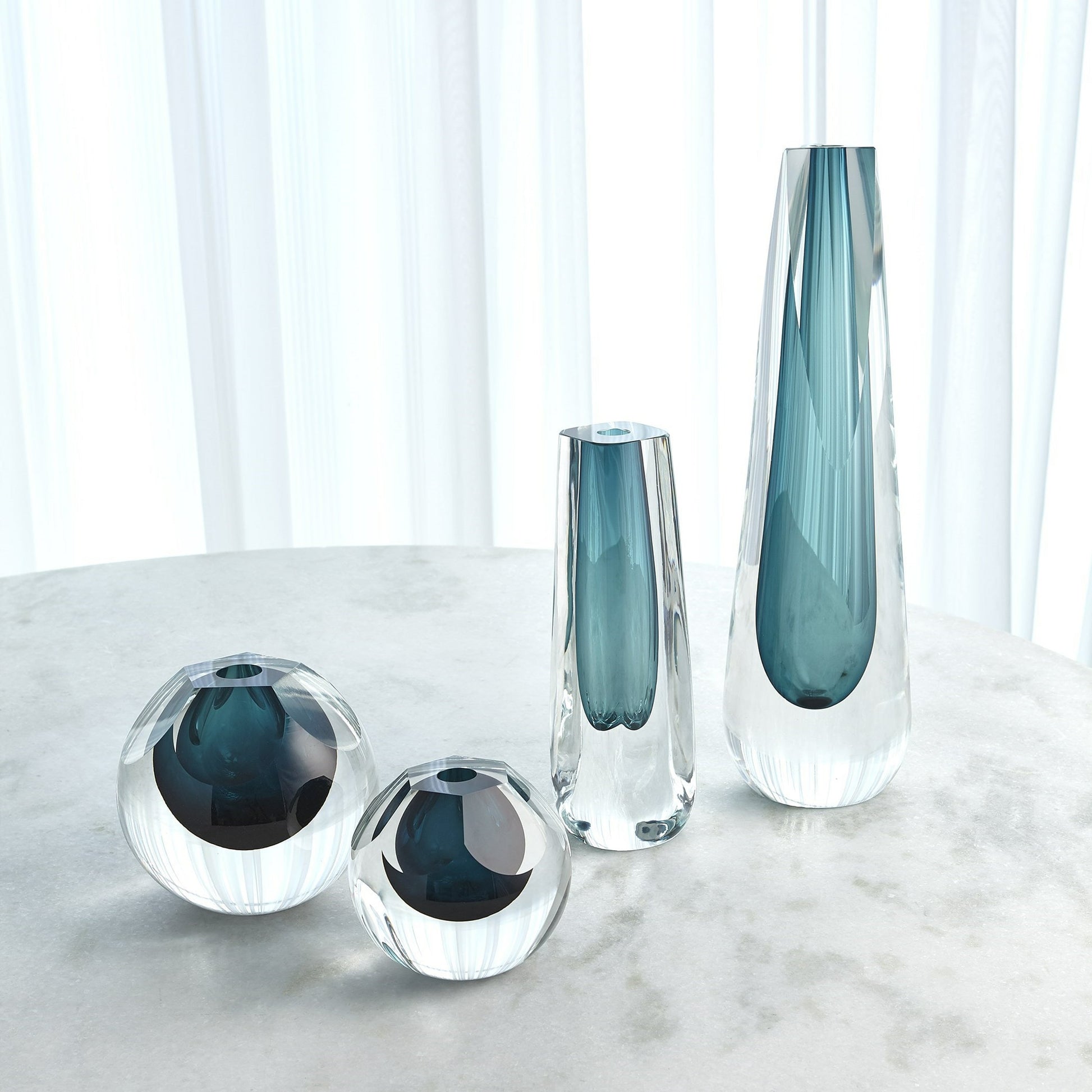 Triangle Cut Glass Vase by Global Views. Made from art glass in a modern style.