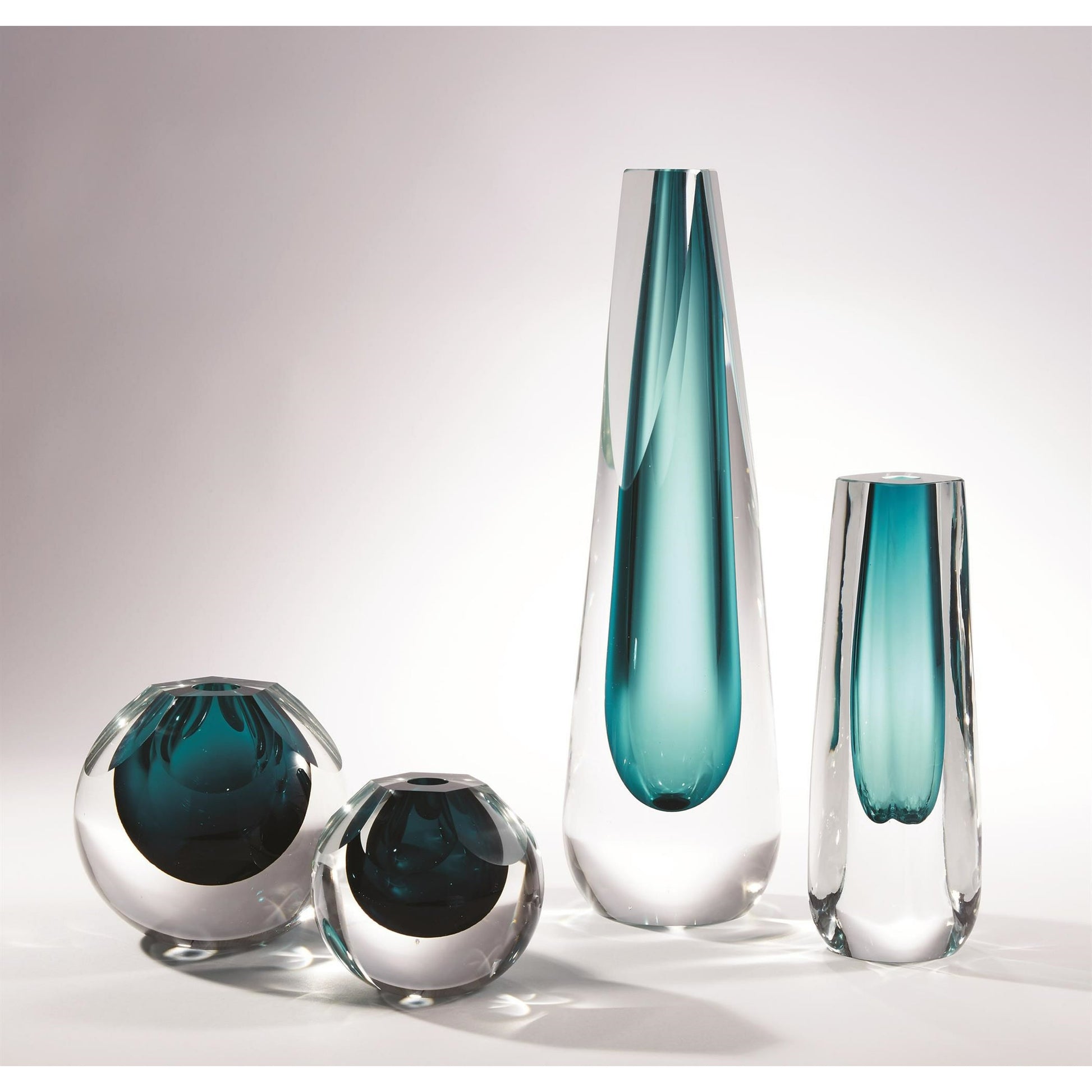 Hexagon Cut Glass Vase by Global Views. Made from art glass in a coastal style.