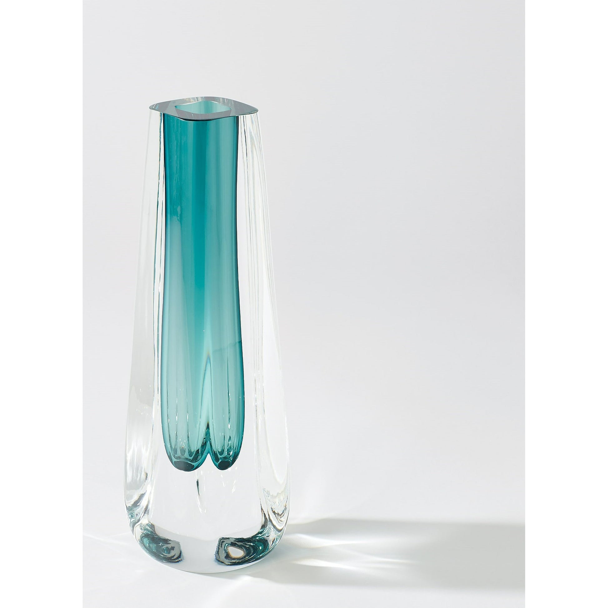 Square Cut Glass Vase by Global Views. Made from art glass in a coastal style.