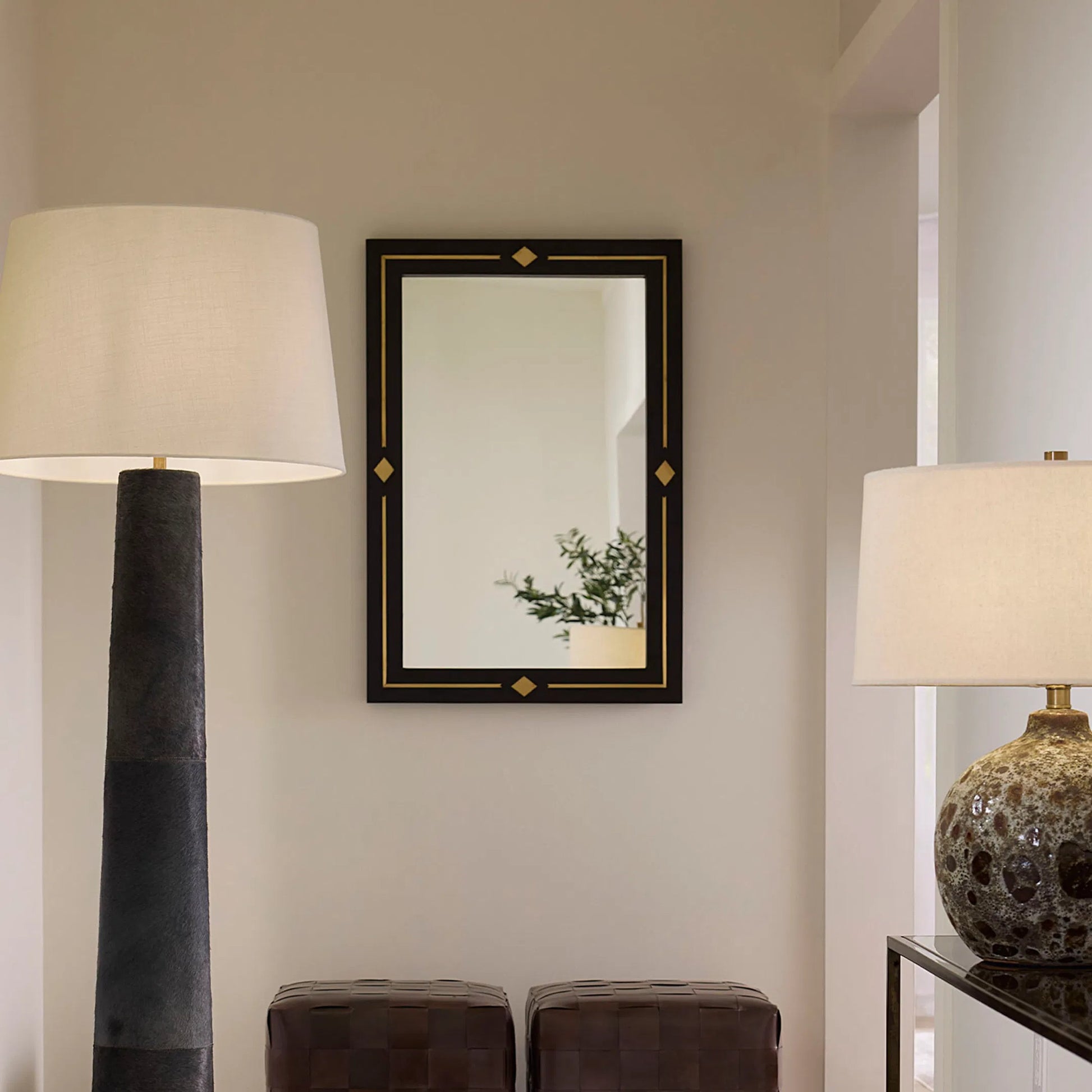 Lloyd Mirror by Jamie Young in black. Made from wood in a unique style.
