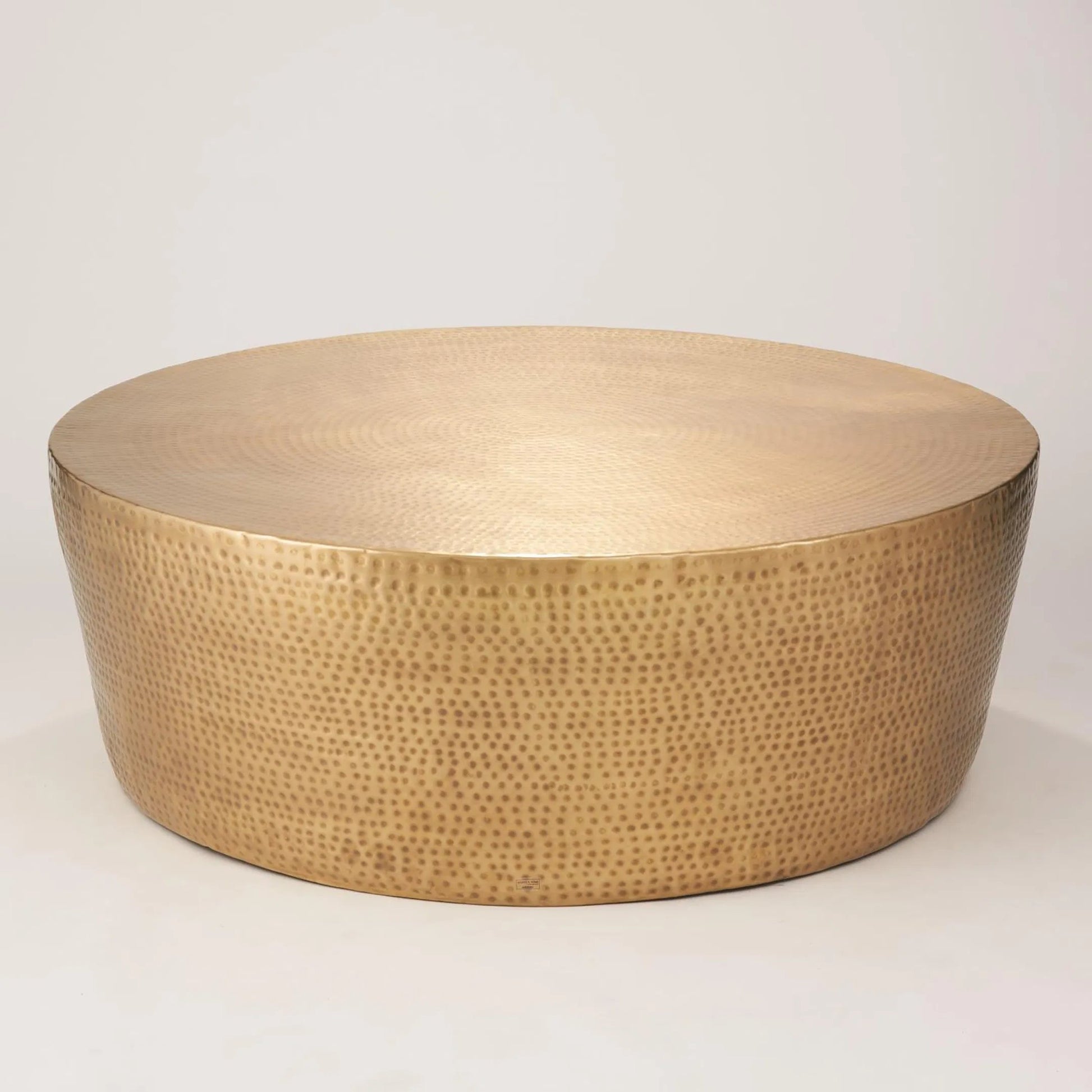 Izmir Hammered Cocktail Table by Global Views. Made from brass in a eclectic & global style.