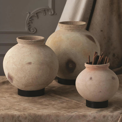 Desert Water Pot with Base by Global Views in burnt wax. Made from iron, terracotta in a rustic style.