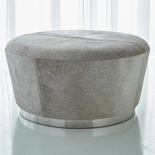 Tapered Ottoman by Global Views in nickel. Made from mdf, stainless steel, leather in a modern style.