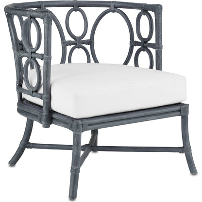 Tegal Chair by Currey and Company in vintage navy, indigo. Made from rattan, plywood, fabric, foam in a coastal style.